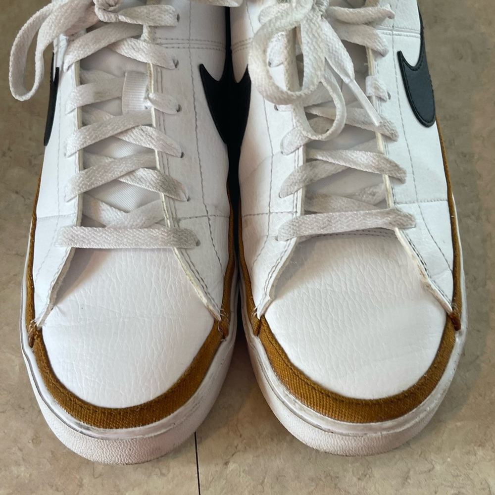 Nike Women's White and Gold Sneakers with Black Swoosh